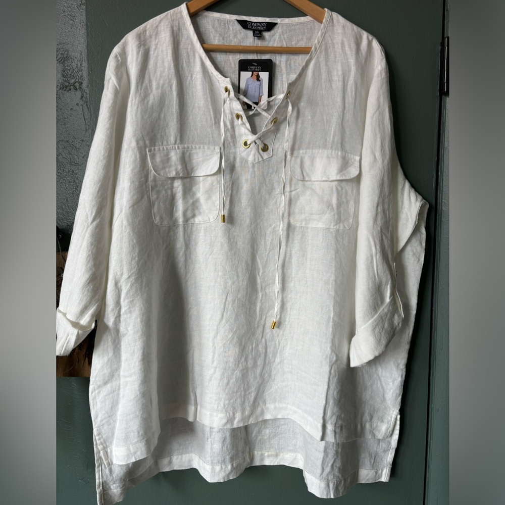 Crisp white linen blouse, with gold accents & lace up detail.